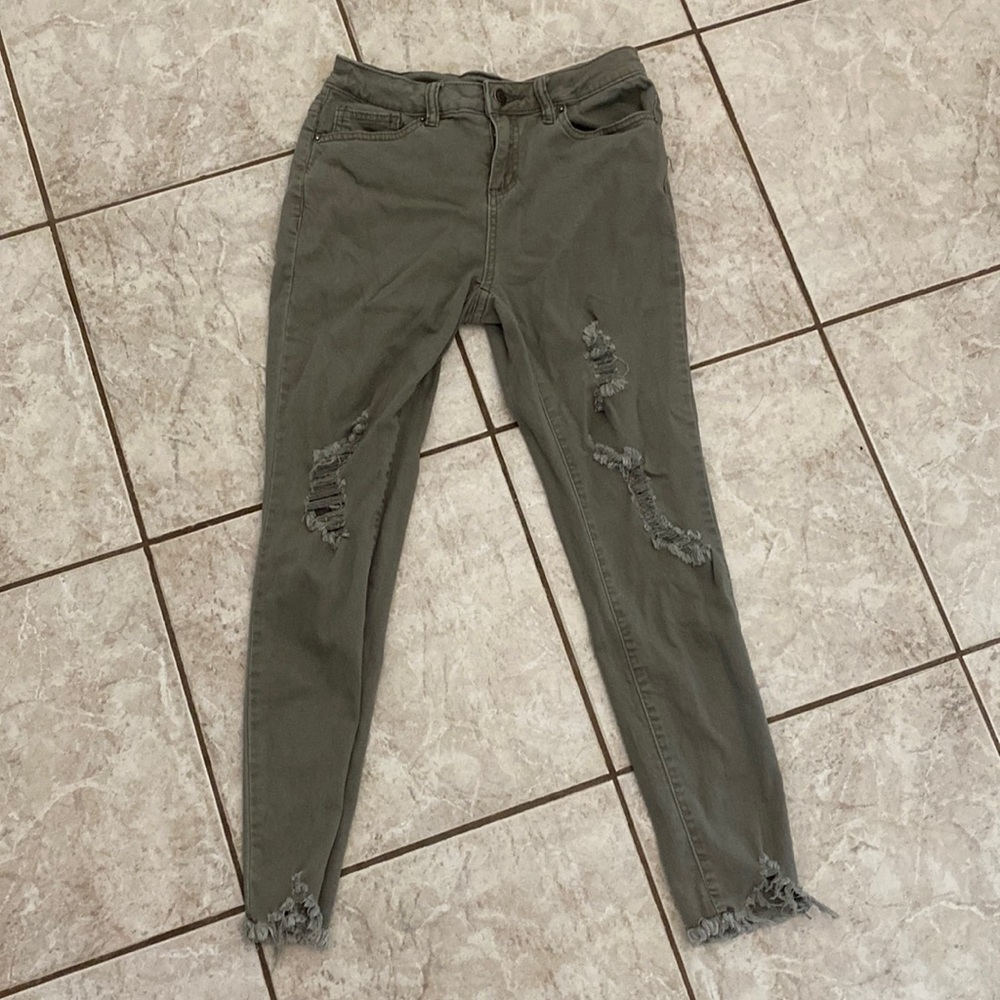 Distressed olive skinny jeans